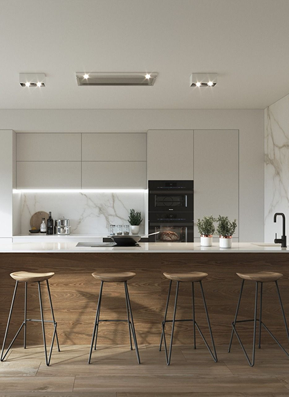 Cocina moderna con barra de madera, taburetes industriales y detalles en mármol, iluminada con luz led.